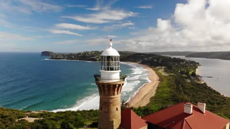 Palm-beach-lighthouse-aerial-view,-stunning-aerial-view-of-Palm-Beach,-Sydney,-with-its-panoramic-coastline,-crystal-clear-waters,-and-iconic-lighthouse