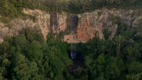 Purling-Brook-Falls-filmed-with-a-Drone-going-forward,-Australia