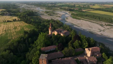 Village-and-castle-of-Rivalta-with-Trebbia-River-in-rural-landscape,-Piacenza-in-Italy