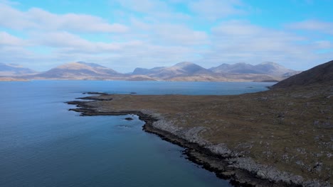 Mountains-and-Sea-Meet-on-Harris-Island,-Scotland-on-partly-cloudy-day-Aerial-View