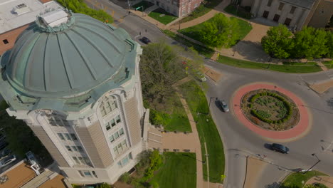 Overhead-aerial-view-of-City-Hall-in-University-City-as-cars-drive-around-a-roundabout-on-Delmar-in-St