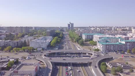 Slow-descending-aerial-shot-of-Genex-and-Roundabout-and-highway,-Belgrade