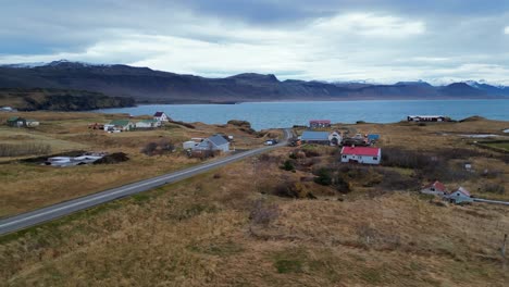 Scattered-Houses-at-Icelandic-Wild-Coast,-Beautiful-Nature-AERIAL