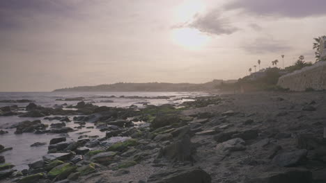 Late-afternoon-time-lapse-on-a-rocky-beach-with-a-background-out-of-focus