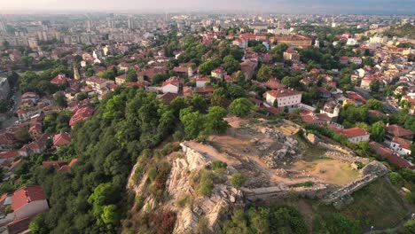 Aerial-View-of-Plovdiv-Old-town,-Bulgaria-and-Roman-Theatre-of-Philippopolis-Above-Cityscape,-Drone-Shot