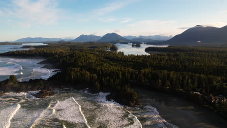 Drone-pullback-over-remote-beach-fringed-with-Vancouver-Pacific-Coast-rainforest