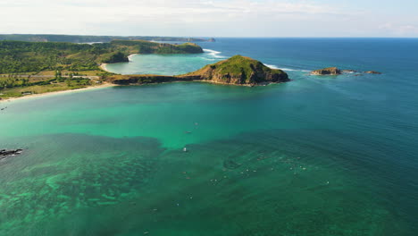 Aerial-flying-over-paradise-coast-of-Kuta-in-golden-hour,-Lombok,-Indonesia