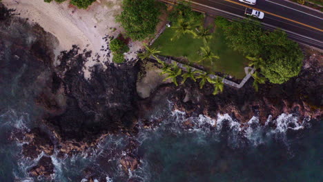 Scenic-Tropical-Kona-Bay-Hawaii-Rocky-Ocean-Shore-And-Coastal-Road-At-Sunset,-4K-Aerial-Drone