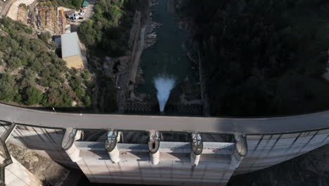Aerial-birdseye-of-Sau-reservoir-dam-with-little-water-runoff,-Catalonia,-Spain
