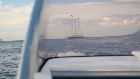 Luxury-Sailing-Ship-Near-The-Coast-From-The-Cabin-Of-A-Fast-Boat-In-Slowmotion-In-France