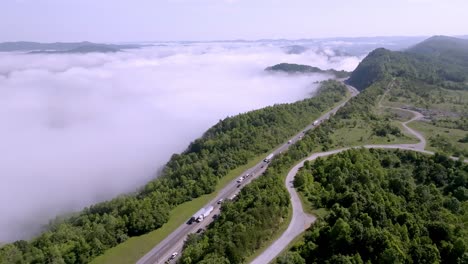 Clouds-and-fog-along-with-traffic-on-Interstate-75-near-Jellico,-Tennessee-in-the-Cumberland-Mountains-with-drone-video-moving-in-wide