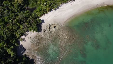 Drone-view-of-tropical-paradise-beach,-Manuel-Antonio-National-Park,-Costa-Rica