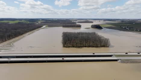 Flooded-area-in-southern-Indiana-farmland-next-to-freeway-with-drone-video-wide-shot-pulling-back