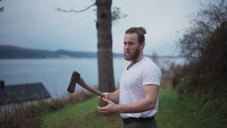 Man-Playing-With-Axe,-Throwing-Up-And-Catching