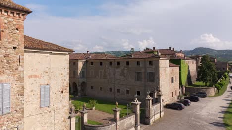 Drone-ascending-point-of-view-of-Agazzano-castle-in-Italy