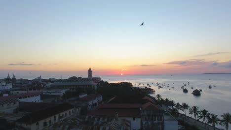 Drone-stock-footage-of-Zanzibar-Island,-sunset-over-the-shoreline