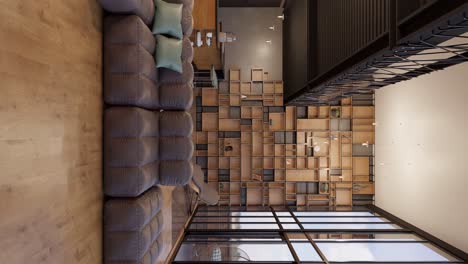Vertical-shot-of-brown-padded-couches-with-different-colored-boxes-on-the-wall