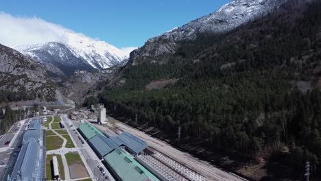 Aerial-ascends-over-iconic-old-train-station-in-Spanish-Pyrenees-mtns