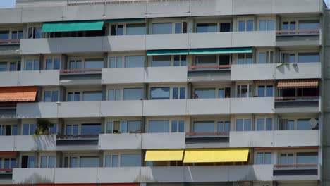 A-building-with-colored-awnings-in-Geneva,-Switzerland