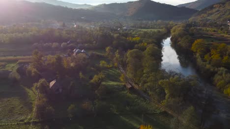 Impressive-aerial-view-of-picturesque-countryside-of-Transylvania,-Romania,-fly-by-footage-at-sunset,-autumn