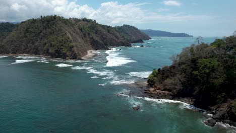 Waves-crashing-between-coastline-and-island-in-Costa-Rica