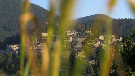Old-Typical-Provencal-Country-Village-Under-Sunny-Skies-in-slowmotion-moving-shot-through-nature
