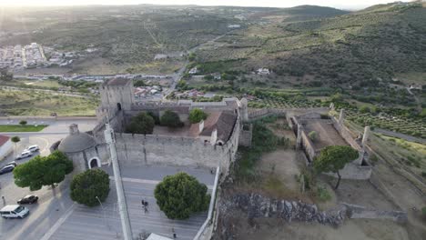 Wide-aerial-pan-of-Castle-of-Elvas-and-green-landscape-in-Portugal