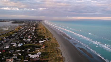 New-Brighton-beach,-Christchurch,-New-Zealand-aerial-shot-fly-forward-above-shore