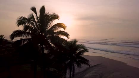 Establishing-aerial-shot-of-dramatic-sunrise-over-beautiful-beach-in-Brazil