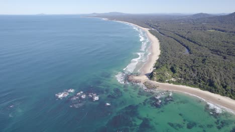 Aerial-View-Over-Wenonah-Head-With-Turquoise-Seascape-In-Urunga,-NSW,-Australia---drone-shot