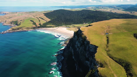 Aerial-over-Parakanui-with-sandy-beaches-and-cliffs-in-the-South-Island-of-New-Zealand