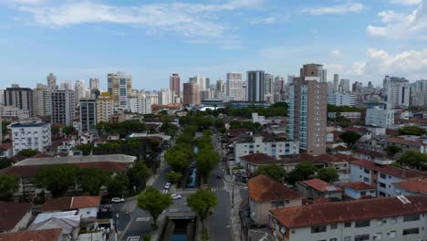 Aerial-view-overlooking-quiet-streets,-in-sunny-Santos,-Brazil---tracking,-drone-shot