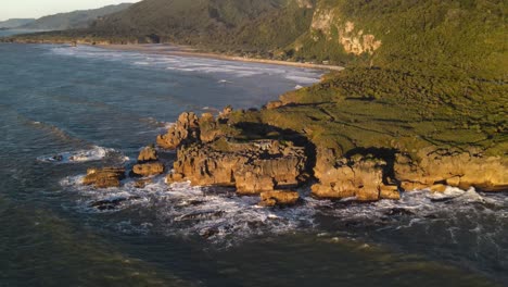 New-Zealand-coastal-during-golden-hour-and-spectacular-geological-formation-with-lookout---birds-eye-view