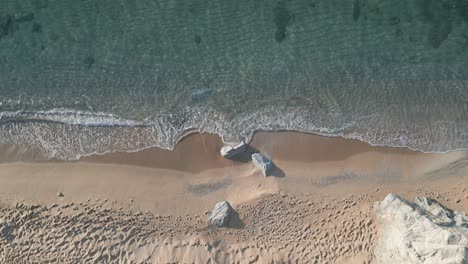Aerial-Drone-Coastline-View,-Pristine-Sand-and-Blue-Sea-Waves-at-Arenys-de-Mar-Beach,-Catalonia,-Barcelona,-Spain,-Europe