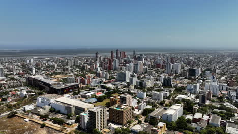Aerial-view-of-downtown-Barranquilla,-sunny-day-in-Colombia---tracking,-drone-shot