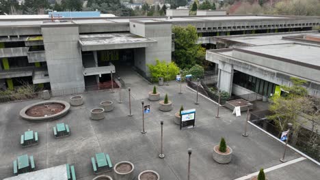 Aerial-view-pulling-away-from-an-empty-courtyard-at-North-Seattle-College