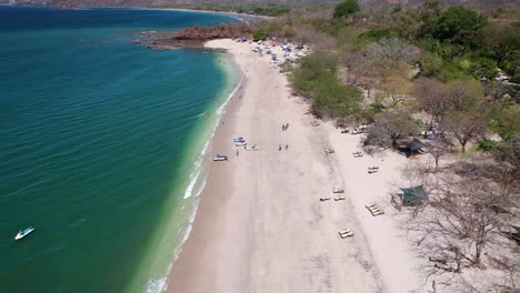 Drone-dolley-tilt-shot-over-Conchal-beach-in-Costa-Rica-on-a-sunny-summer-day