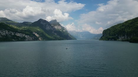 forward-shot-Boats-sailing-on-the-lake-in-Gäsi-Betlis,-Walensee-Glarus,-Weesen-Walenstadt,-Switzerland--drone-view