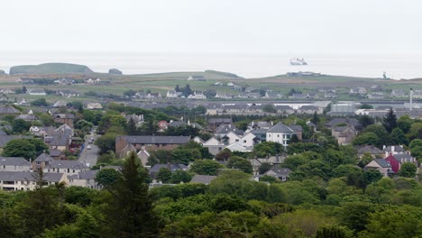 Telephoto-shot-of-a-ferry-vessel-sailing-away-from-the-small-port-village-of-Stornoway