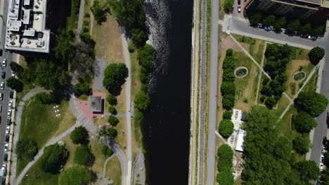 Aerial-view-over-the-Canal-de-Lachine,-in-sunny-Montreal,-Canada---top-down,-drone-shot