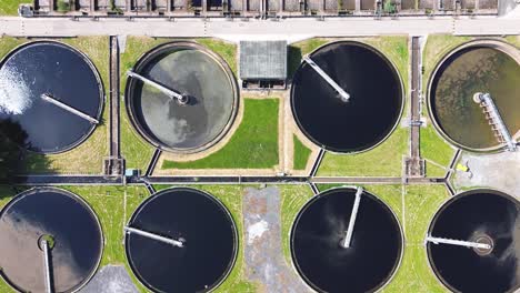 Aerial-top-view-of-circular-ponds-in-wastewater-treatment-plant-and-filtration-of-dirty-sewage-water