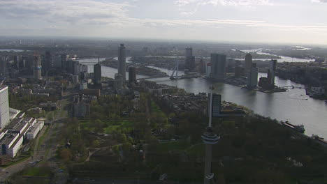 Aerial-shot-of-the-Erasmus-bridge-and-surrounding-Rotterdam-during-the-day,-Netherlands