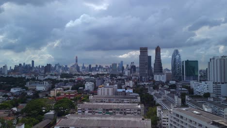 Suburban-buildings-in-the-background-cloudy-skyscrapers-and-sky-line-of-the-city-Unbelievable-aerial-view-flight-Bangkok-District-ari,-thailand-2022