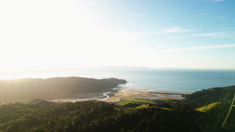 Coastal-mountains-and-sandy-beach-of-New-Zealand,-aerial-drone-view