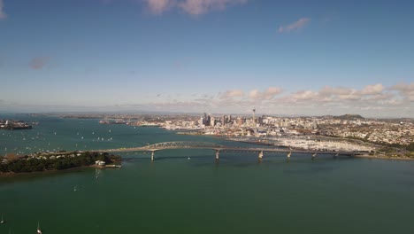 Aerial-high-rise-fly-to-massive-construction-of-Auckland-Harbour-Bridge