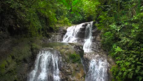 A-beautiful-waterfall-surrounded-by-lush-vegetation