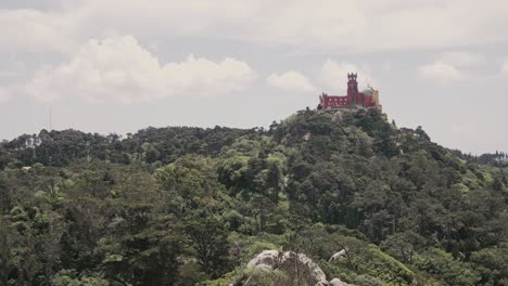 Green-forest-and-Pena-Pacale-in-Sintra,-pan-right-view