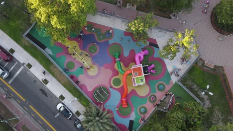 Time-lapse-drone-shot-of-playing-kids-in-playground-at-park-or-Buenos-Aires