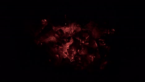 Flaming-hot-coals-in-a-sauna-oven,-extreme-heat