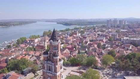 Fantastic-opening-aerial-shot-of-Gardos-Tower-in-Zemun-and-old-city-on-hill,-summer-day
